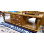 A modern two tier teak coffee table,