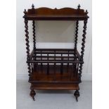 A mid Victorian rosewood Canterbury, the galleried upper tier over a spiralled, central section,