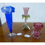 Three pieces of coloured art glass: to include a late Victorian/Edwardian cranberry coloured cream