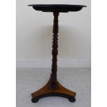 A William IV rosewood pedestal table, raised on a slender, knopped and ring turned column,