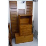 A modern Ladderax style two modular section, teak living room unit,