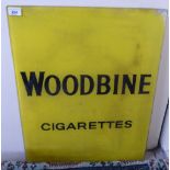 An early 20thC Woodbine cigarette advertising sign, reverse printed in black on yellow glass 25.