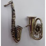 Two miniature silver woodwind instruments, viz.