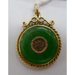 A Chinese gold coloured metal and jade set disc design pendant 11