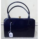 A 'vintage' Harrods Eros blue leather handbag with yellow metal clasps SR
