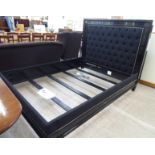 A Ralph Lauren 'Brook Street' tufted bed frame with a black painted,