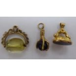 Three 'antique' 9ct gold fob seals of varying designs 11