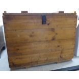 A rustically constructed pine crate with straight sides and a hinged lid 25''h 32''w 24''deep