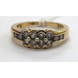 A 9ct gold and rubover diamond set ring 11