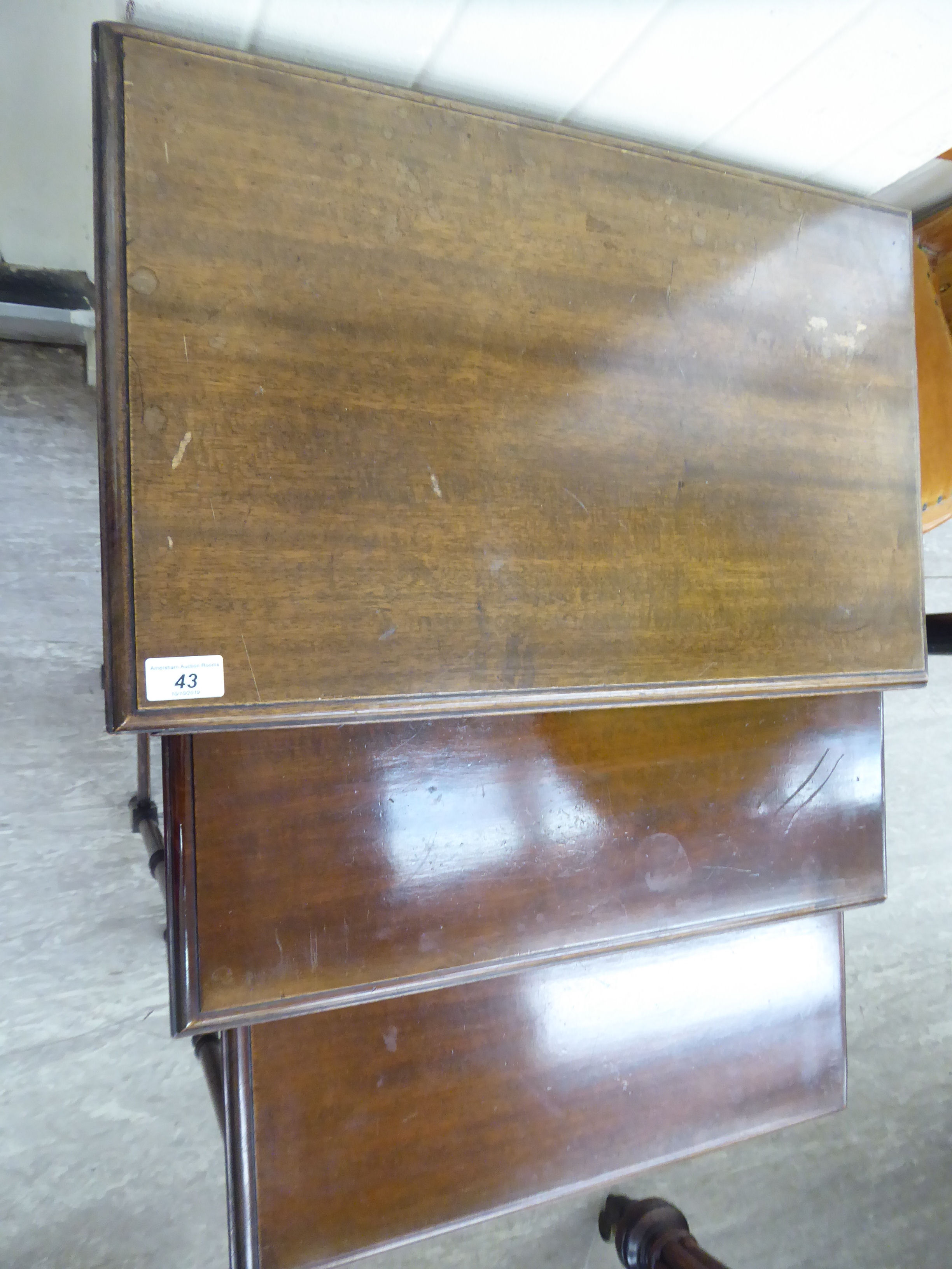 A nesting set of three 20thC mahogany occasional tables, the top with a curved edge, - Image 2 of 3