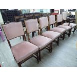 A set of six early 20thC mahogany showwood framed dining chairs, the fabric covered,