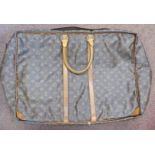 A Louis Vuitton soft sided and zipped weekend case approx.