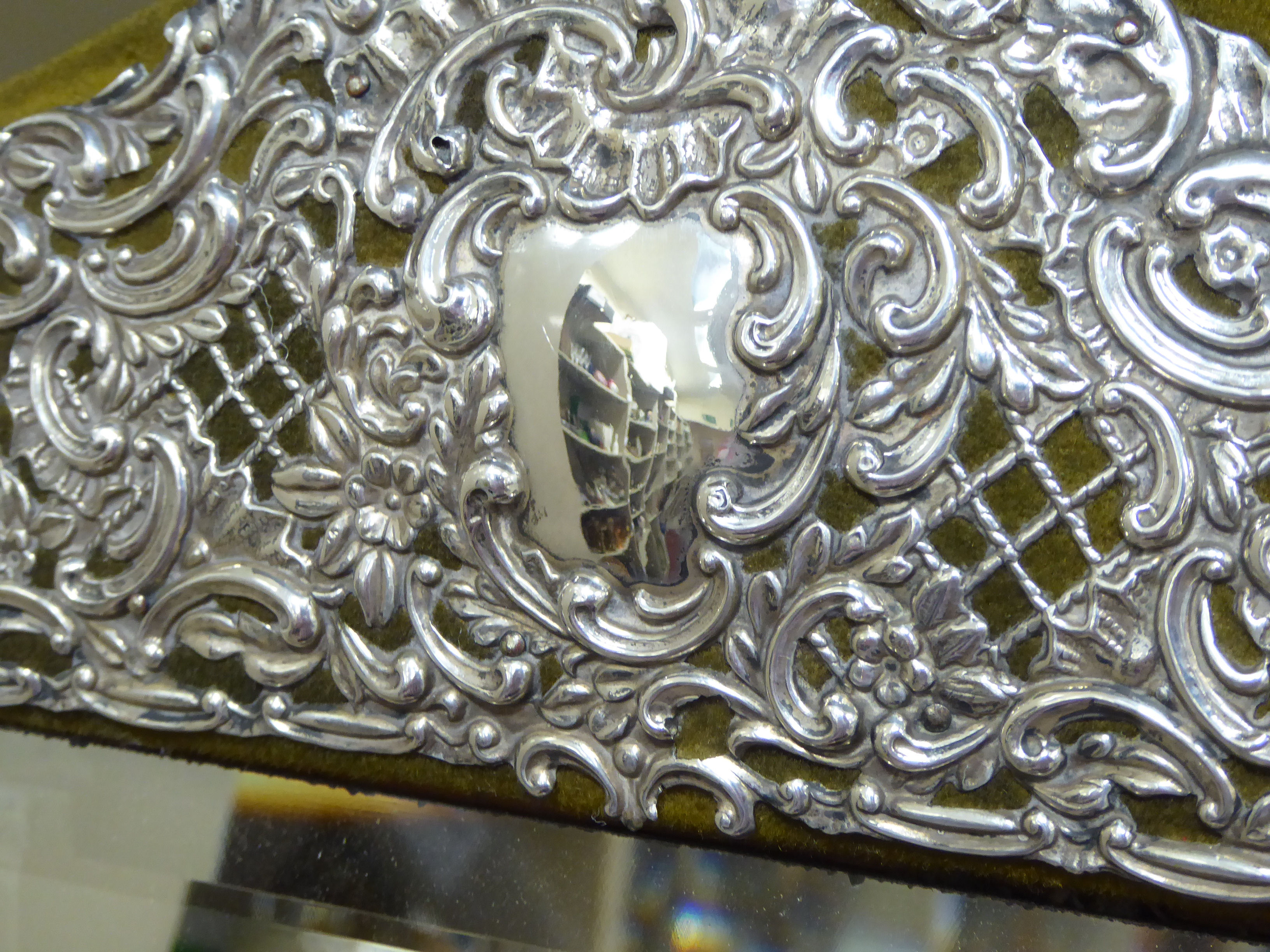 A late Victorian bevelled dressing table mirror, set in a wide green velvet covered frame, - Image 3 of 4