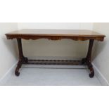 A late Regency rosewood centre table, the top having a thumb moulded edge and round corners,
