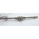 A white metal (possibly platinum) diamond set bar brooch 11