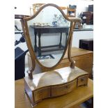A Regency mahogany dressing table mirror with a shield shaped plate,