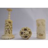 An early 20thC Chinese intricately carved ivory puzzle ball 2''dia on a pedestal stand 7.