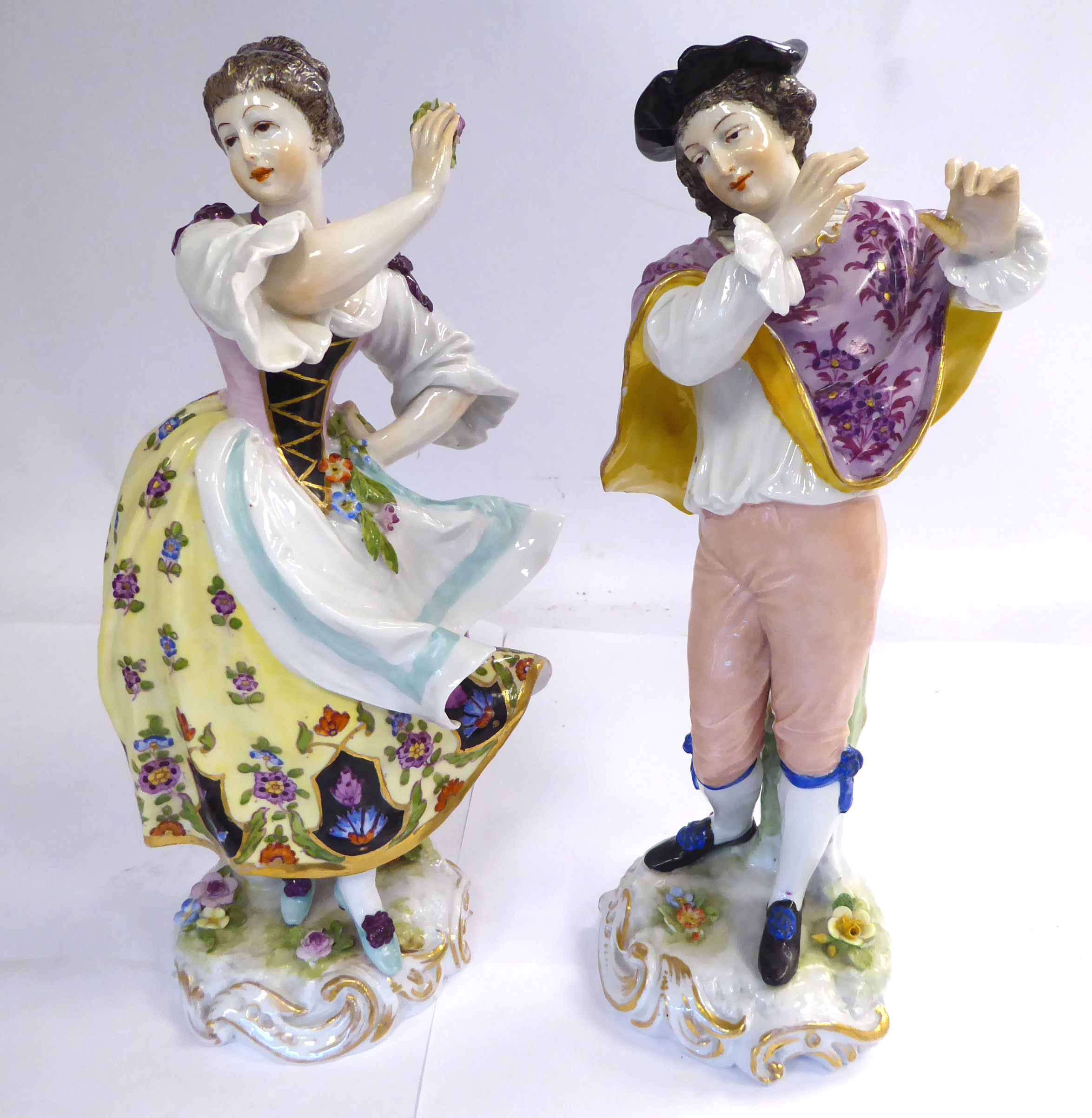 A pair of early 20thC Continental porcelain dancing figure, on scrolled,