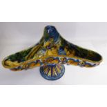 An early 20thC Cantagalli earthenware triform dish, elevated on a conical shaped pedestal foot,