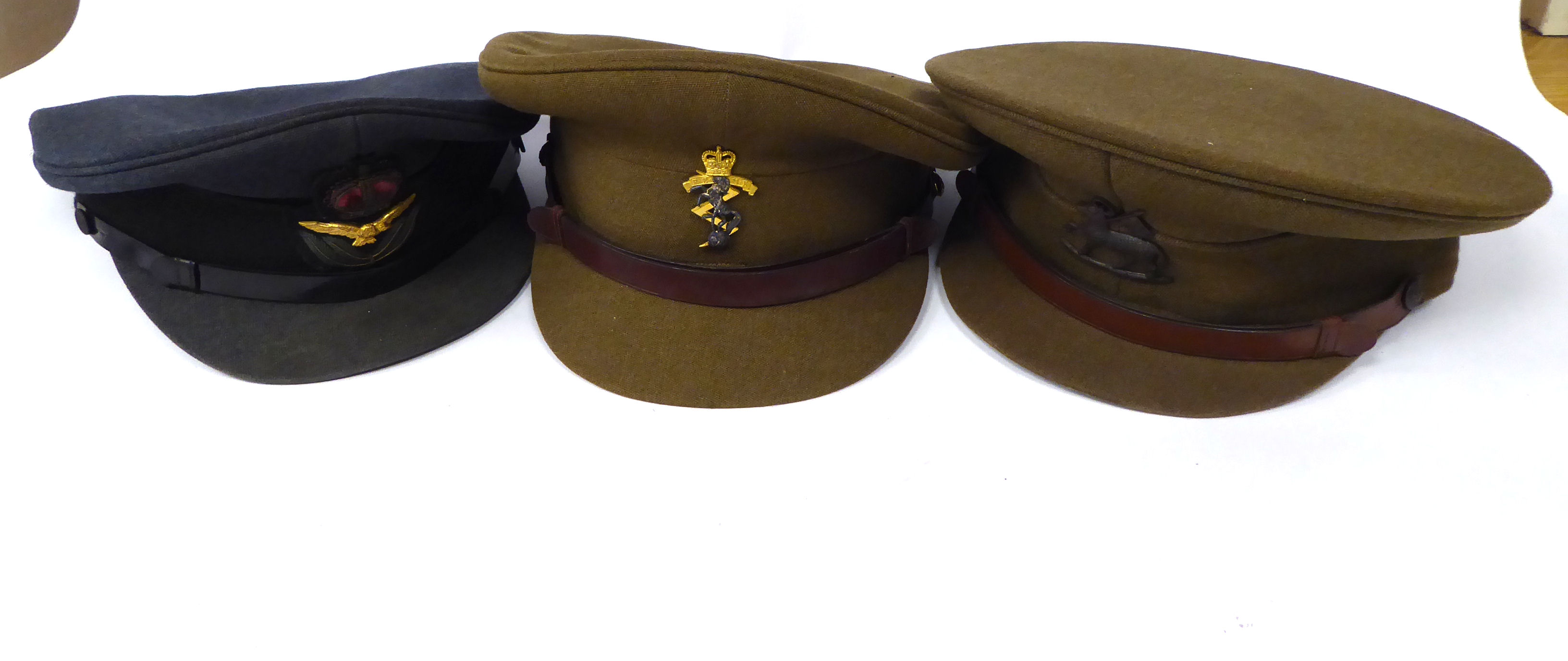 Three British military peaked caps, viz.