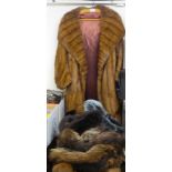 Fur and faux fur clothing: to include a 1950s three-quarter length musquash jacket with a silk