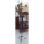 A 20thC Gothic inspired cast metal, twin branch candelabra stand,