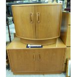 Two Ercol teak living room cupboards with moulded grab handles, one of quadrant form,