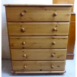 A modern waxed pine five drawer dressing chest,