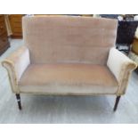 An early 20thC round back, fabric upholstered two person settee,