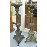 A pair of late 19thC Continental, ecclesiastic, pricket design, pressed lacquered brass,