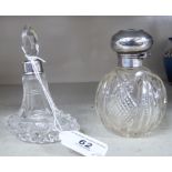 Two dissimilar glass dressing table bottles,