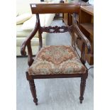 A Regency mahogany framed, floral carved bar back elbow chair,