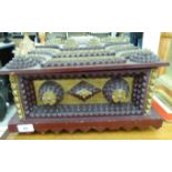 An iron red and gilt painted, carved wooden Tramp Art casket,