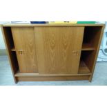 A modern teak cabinet with two sliding doors,