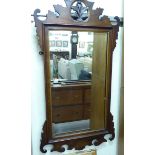 A 1920s Chippendale inspired mirror,