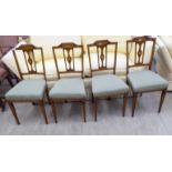 A set of four Edwardian crossbanded and marquetry mahogany framed, pierced splat back dining chairs,