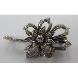 A platinum petal design brooch,