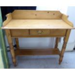 A 20thC waxed pine washstand with a single drawer,