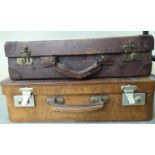 Two early 20thC stitched hide bound suitcases,
