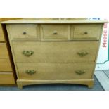 A modern light oak five drawer dressing chest,