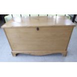 A 20thC bleached pine chest with straight sides and a hinged lid,