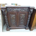 A late Victorian inverted breakfront oak bookcase,