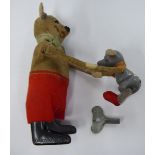 A 'vintage' Schuco tinplate and fabric covered Pooh Bear & Piglet automaton 11