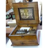 A late Victorian walnut cased polyfon with straight sides and a hinged lid 7''h 16''w with a