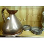 A pair of silver plated wine coasters, on turned mahogany bases; and a one gallon,