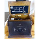 A 1930s oak cased Ogee High Frequency Generator 9''h 12''w (to be sold for display purposes