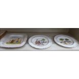 A pair and one similar, Continental pottery wall plates, naively decorated with Artisan figures,