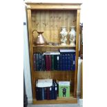 A modern waxed pine open front bookcase with eight height adjustable shelves,