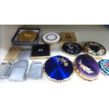 Seven various powder compacts;