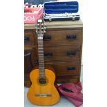 A Hokada six string acoustic guitar;